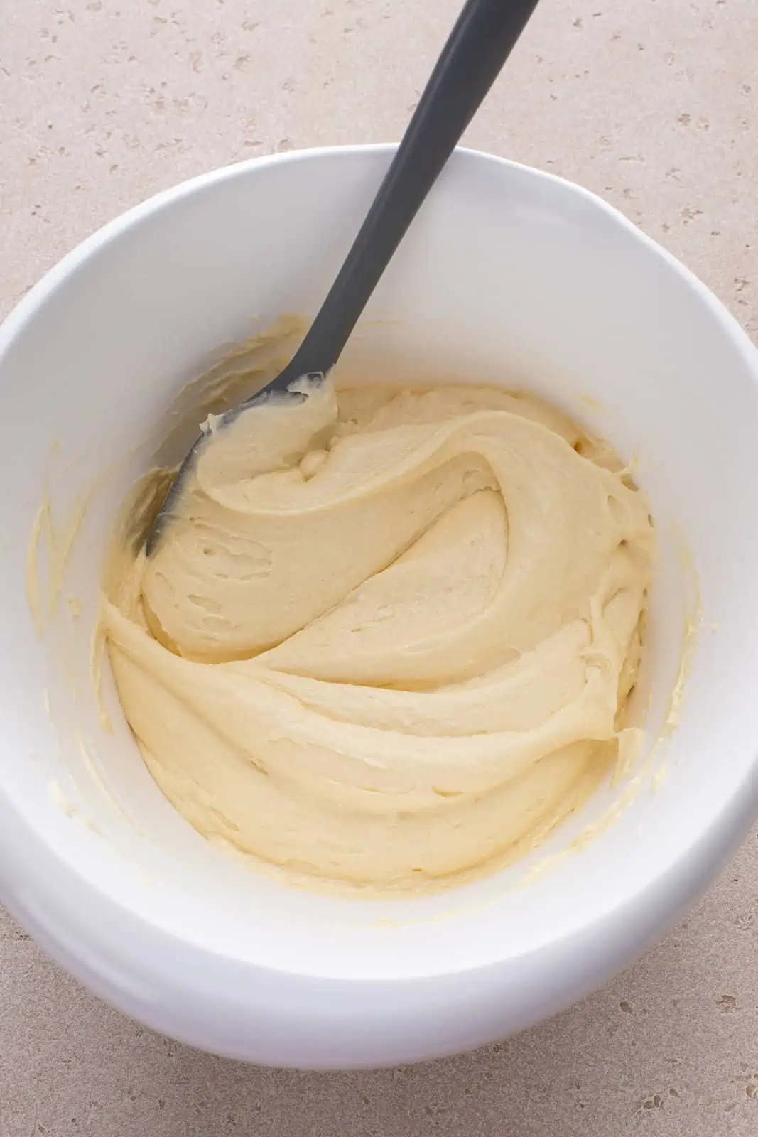 Coffee cake batter in a white bowl.