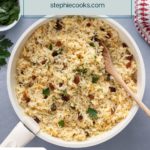 Almond rice pilaf mixed in a white saucepan. Text overlay includes recipe name.
