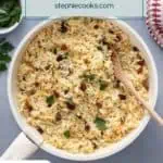 Almond rice pilaf mixed in a white saucepan. Text overlay includes recipe name.