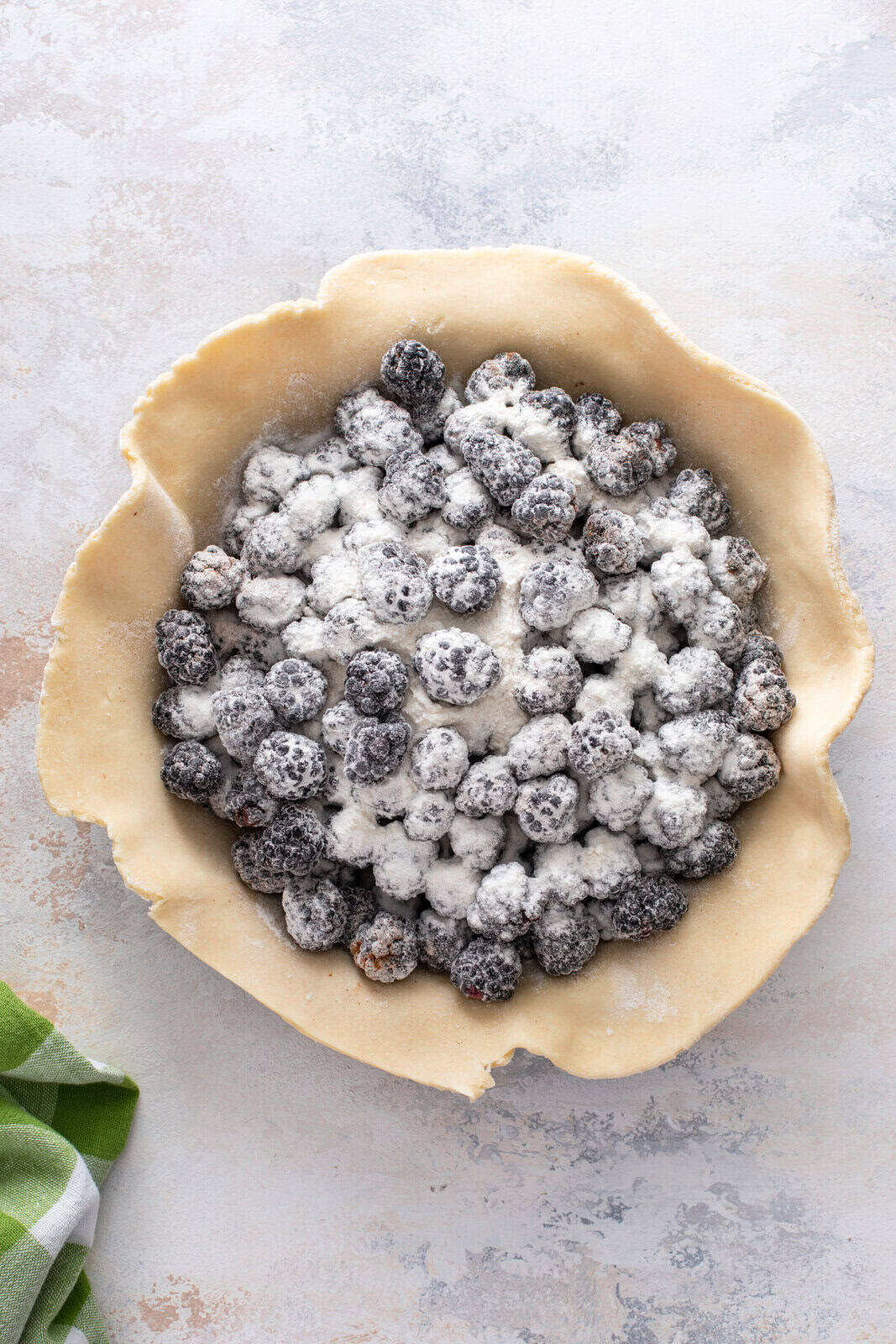 Blackberry pie filling assembled in a pie crust.