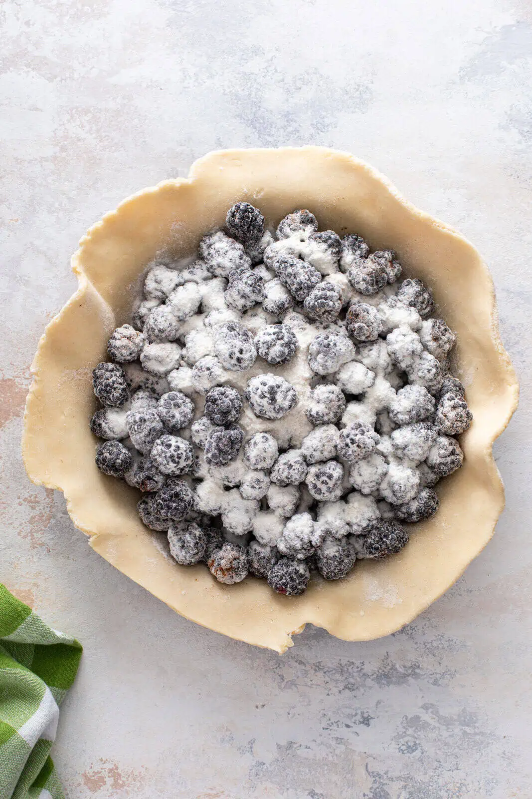 Blackberry pie filling assembled in a pie crust.
