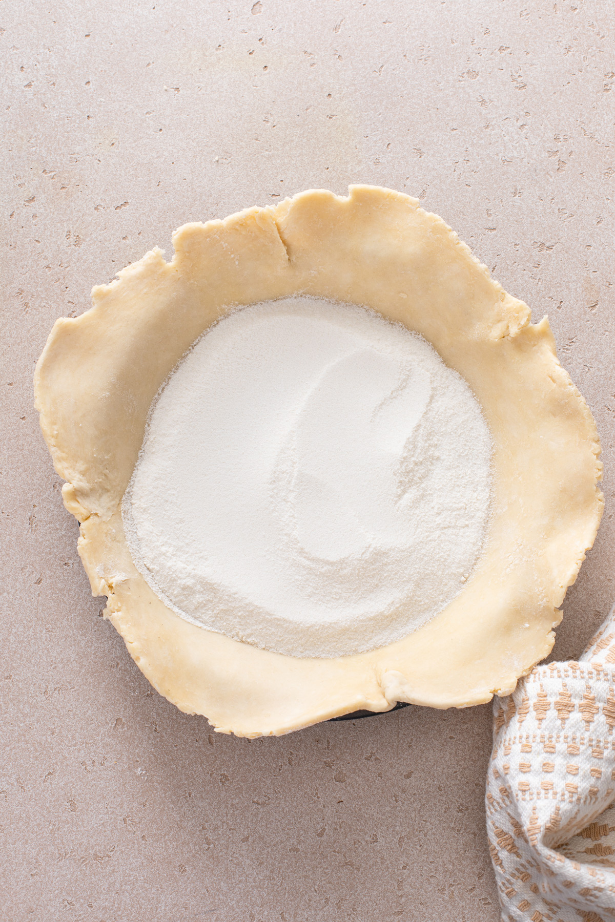 Flour and sugar in the bottom of a pie crust.