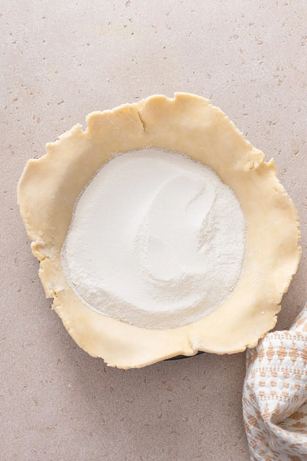 Flour and sugar in the bottom of a pie crust.
