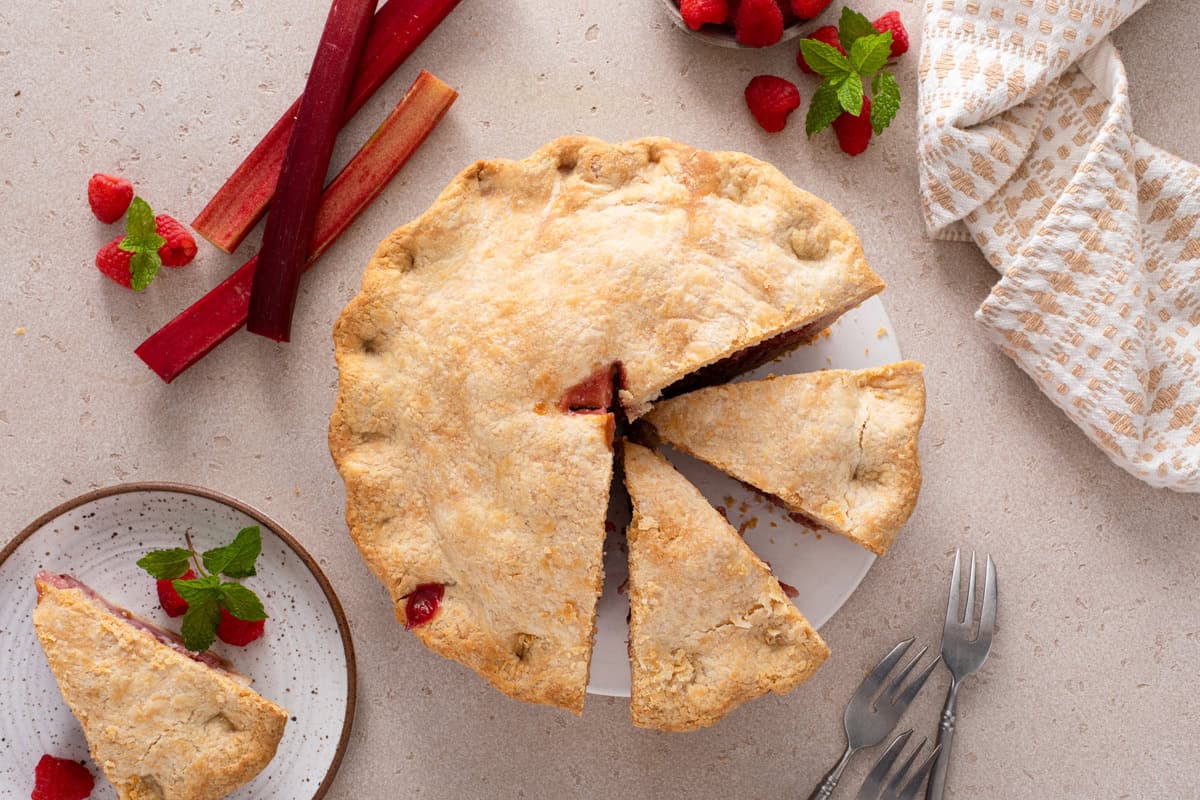 Overhead view of a sliced raspberry rhubarb pie.
