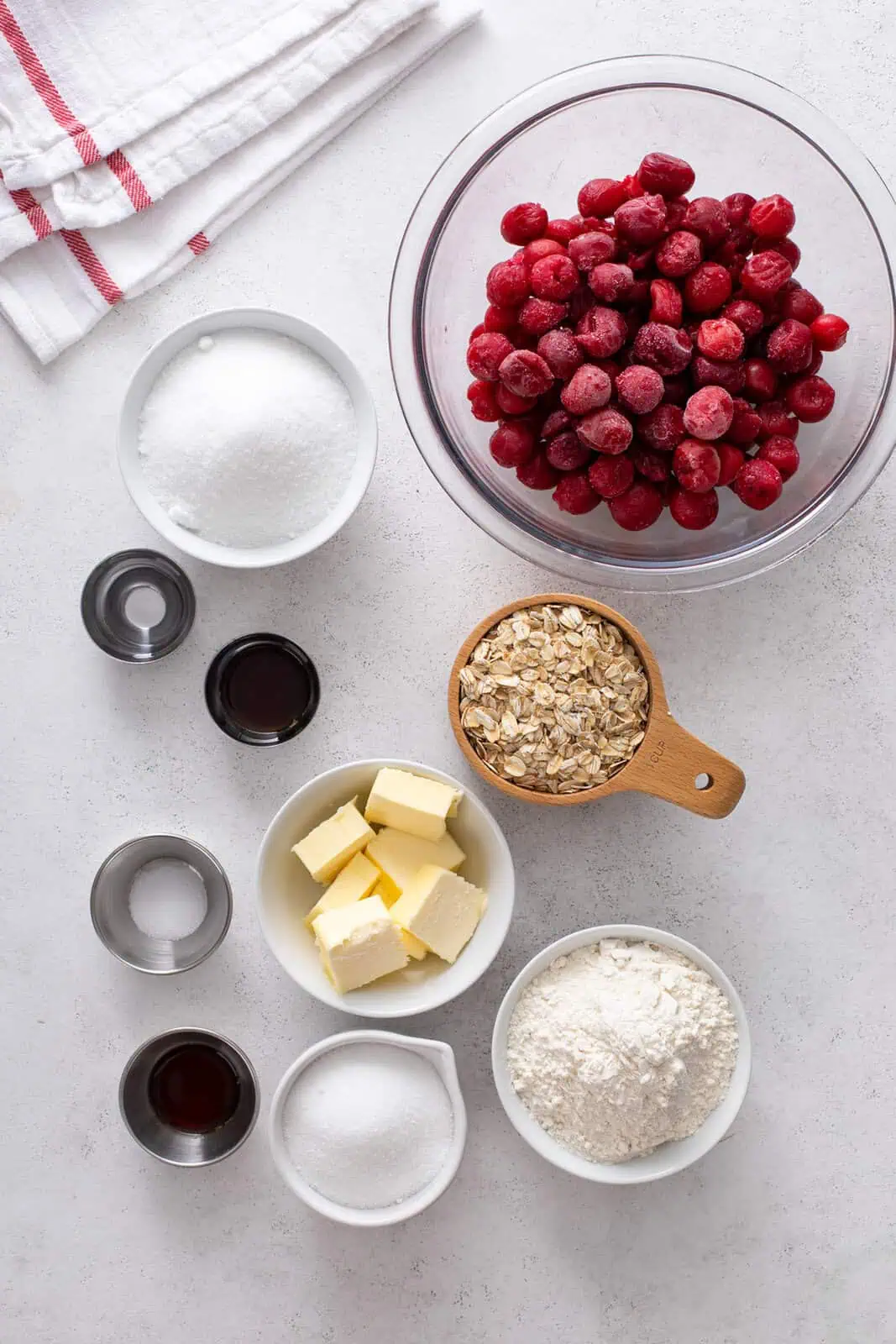Ingredients for sour cherry bars arranged on a countertop.
