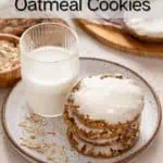 Glass of milk and a stack of iced oatmeal cookies on a plate. Text overlay includes recipe name.