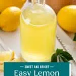 Glass bottle filled with lemon syrup set on a countertop. Text overlay includes recipe name.