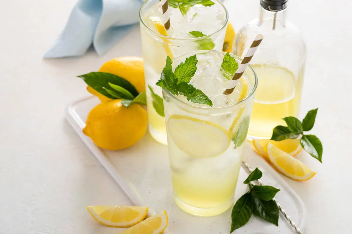 Glasses of lemonade made with easy lemon syrup.