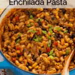 Enchilada pasta in a blue dutch oven, garnished with sliced green onions. Text overlay includes recipe name.