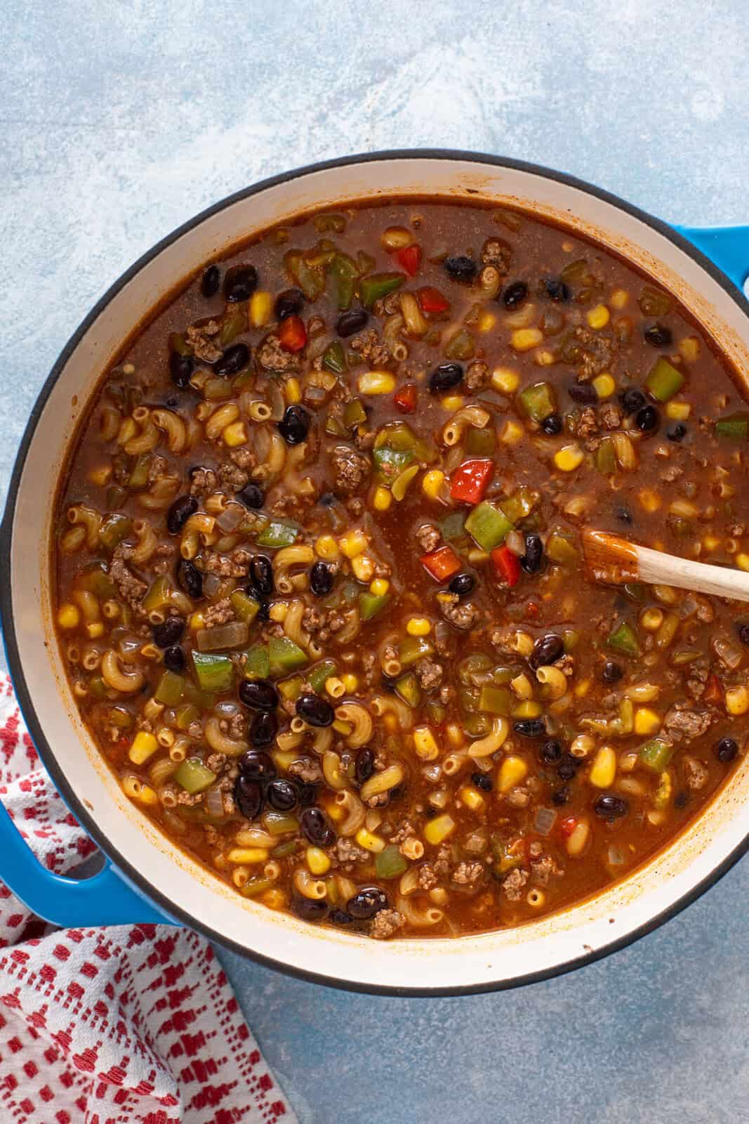 Simmering enchilada pasta in a dutch oven.