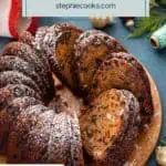 Sliced fruitcake on a wooden serving platter. Text overlay includes recipe name.