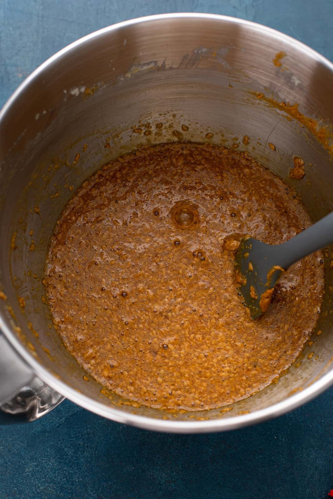 Wet ingredients for old-fashioned fruitcake mixed in a bowl.