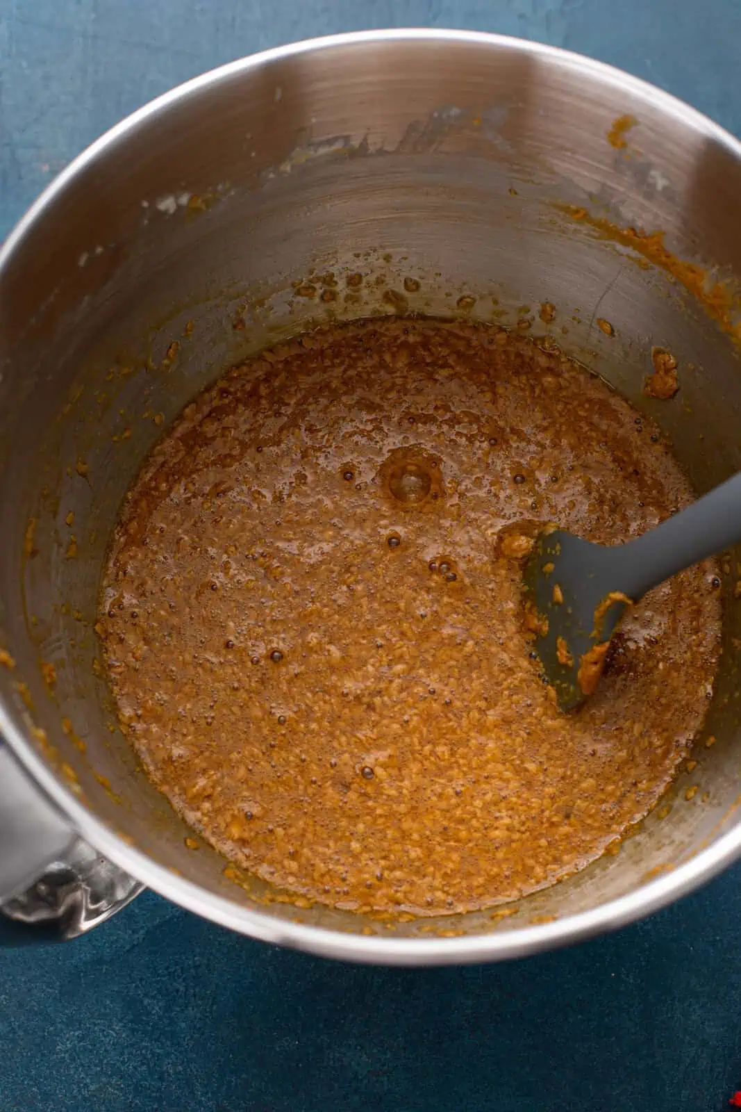 Wet ingredients for old-fashioned fruitcake mixed in a bowl.