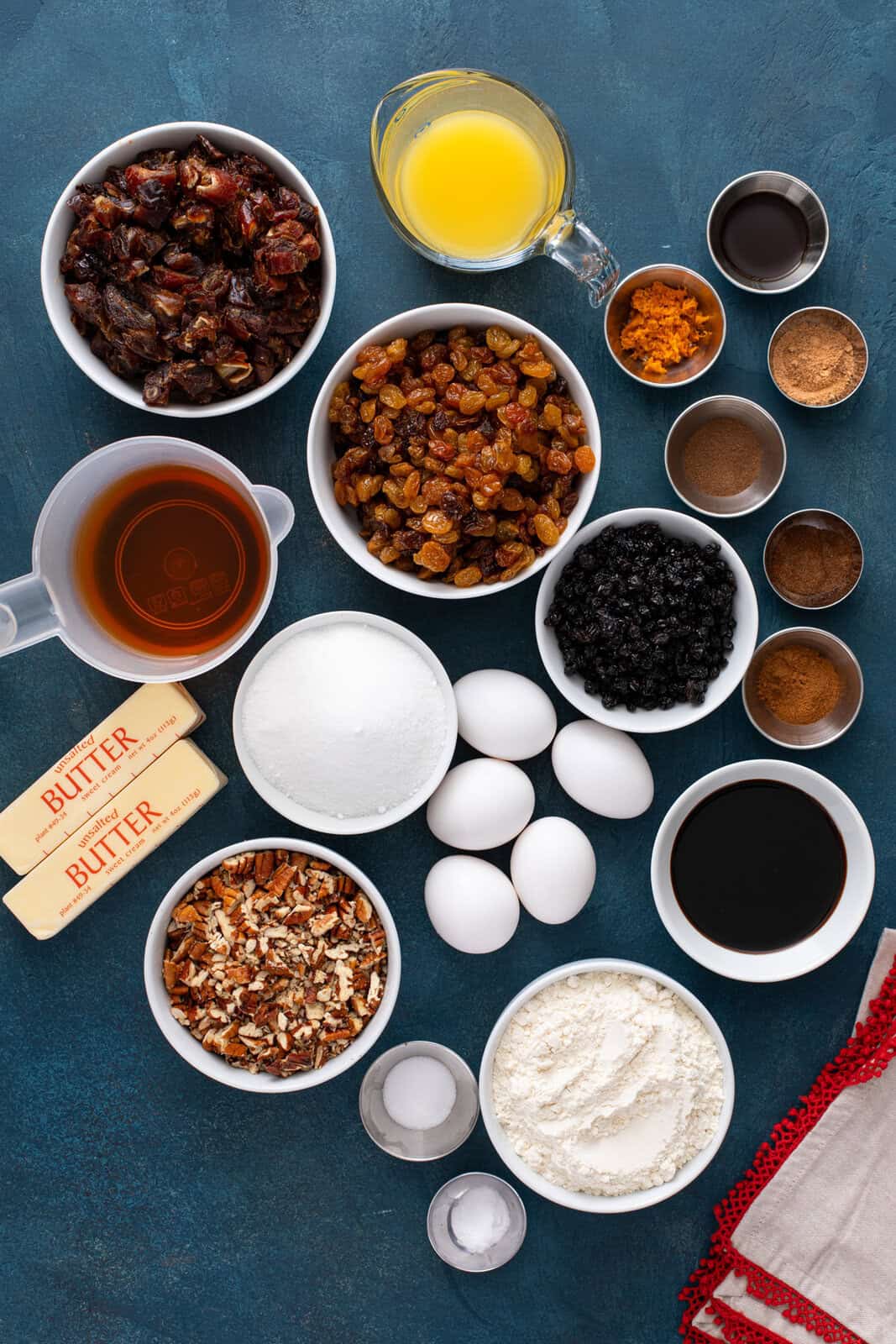 Ingredients for old-fashioned fruitcake arranged on a countertop.