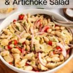 White bean and artichoke salad in a white serving bowl. Text overlay includes recipe name.