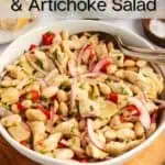 White bean and artichoke salad in a white serving bowl. Text overlay includes recipe name.