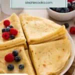 Close up of cooked and folded crepes stacked on a platter. Text overlay includes recipe name.