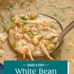 Ladle scooping up a portion of white bean chicken chili from a dutch oven. Text overlay includes recipe name.