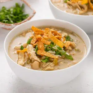 Bowl of white chicken chili on a countertop.