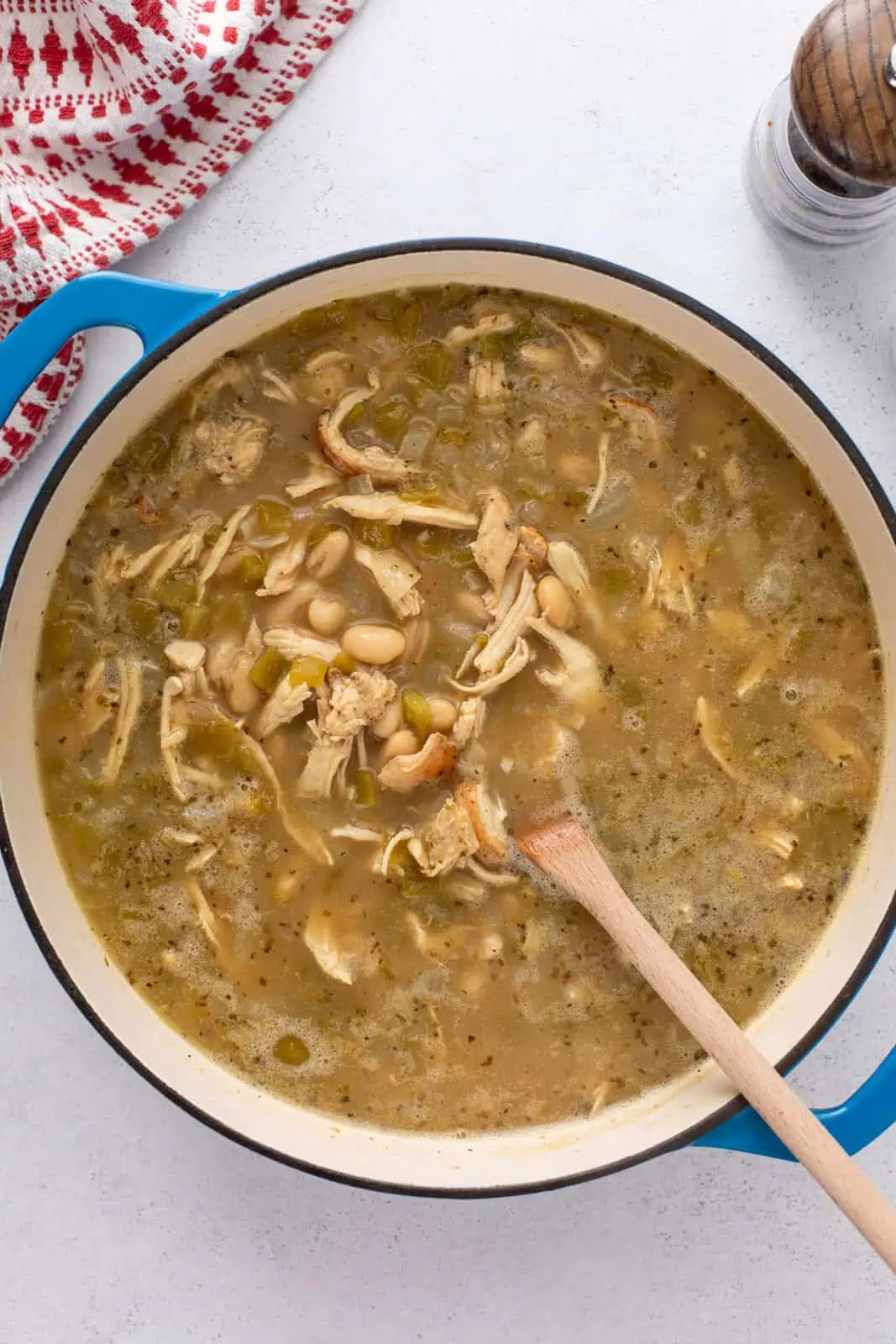 White bean chicken chili simmering in a dutch oven.