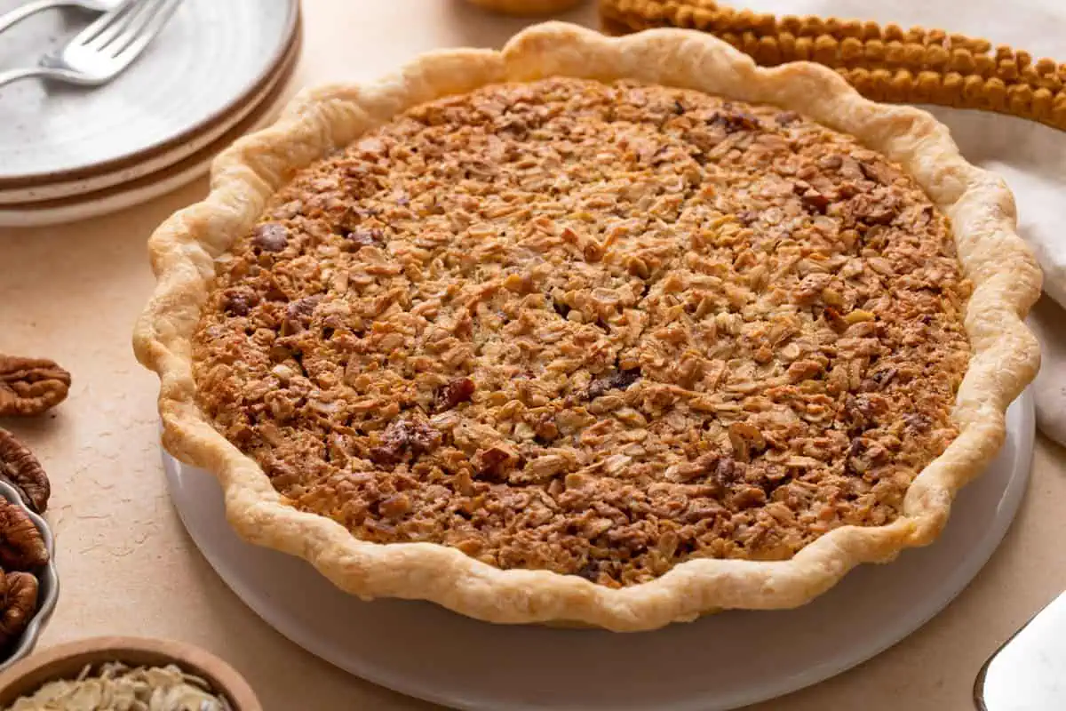 Cooled oatmeal pie on a white platter.