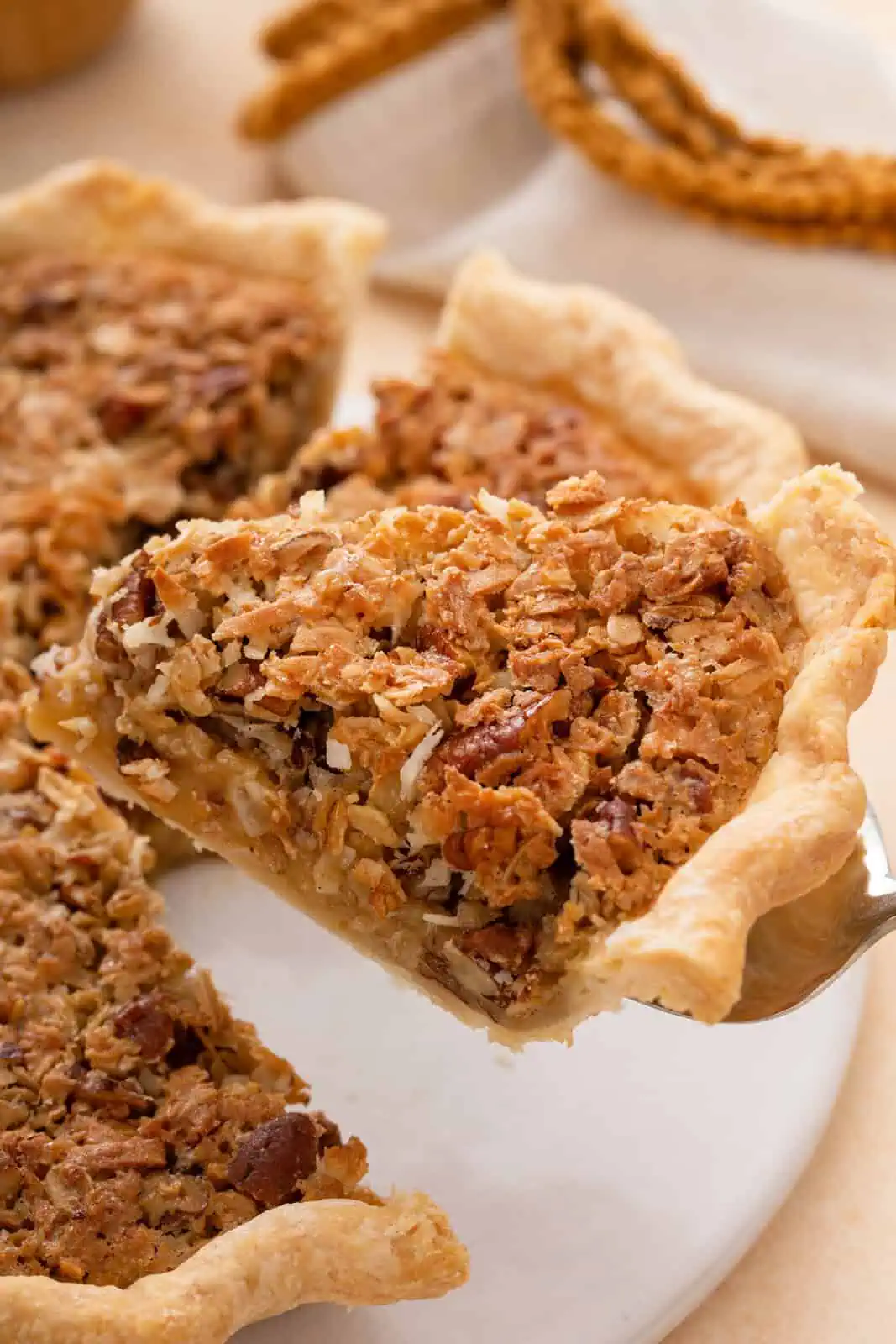 Pie server lifting up a slice of oatmeal pie.