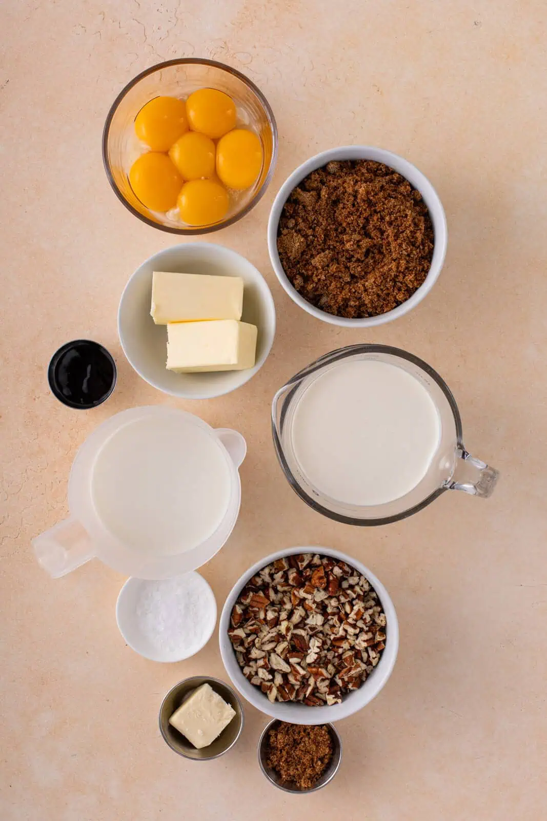 Ingredients for butter pecan ice cream arranged on a countertop.