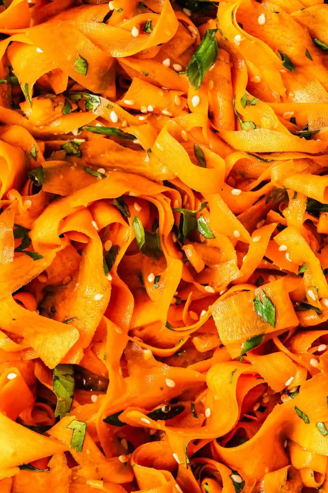 Close up of shaved carrot ribbon salad.