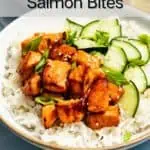 White bowl filled with rice, sliced cucumbers, and air fryer salmon bites. Text overlay includes recipe name.