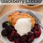 Scoop of vanilla ice cream topping a serving of blackberry cobbler in a white bowl. Text overlay includes recipe name.