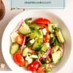 Small white bowl filled with cucumber feta salad. Text overlay includes recipe name.