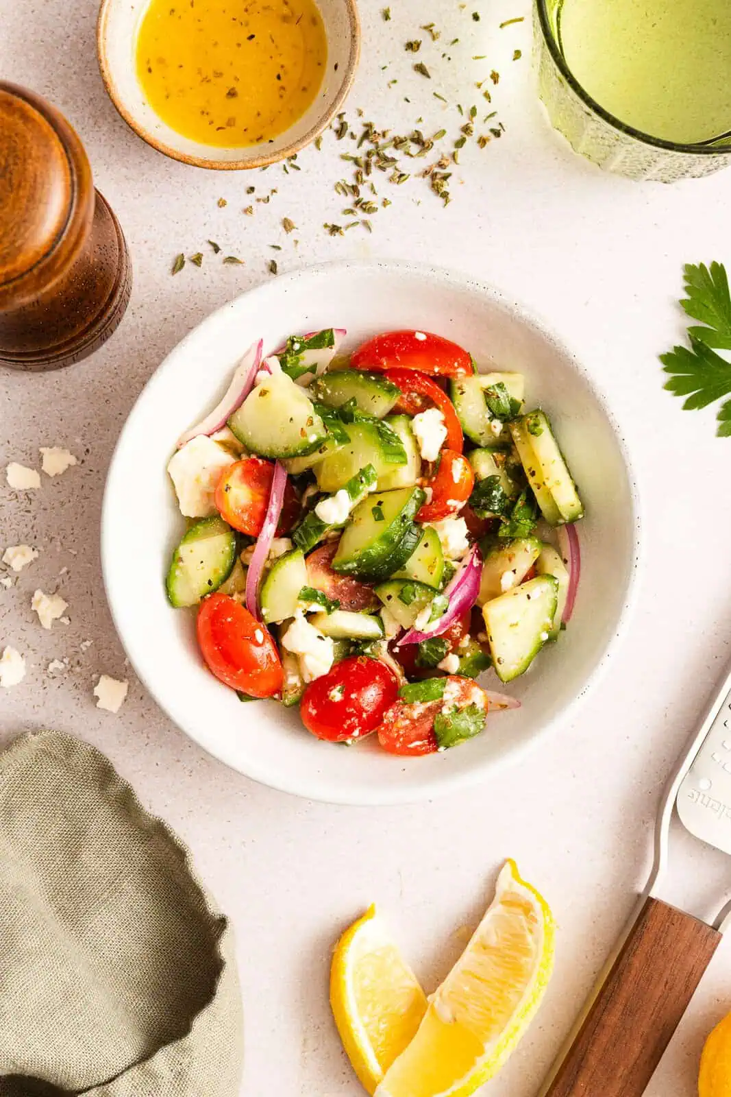 Small white bowl filled with cucumber feta salad.
