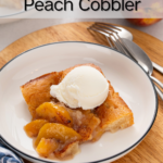 Slice of old-fashioned peach cobbler topped with a scoop of ice cream on a white plate. Text overlay includes recipe name.