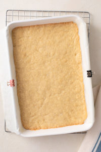 Shortbread crust in a baking pan baked until golden.