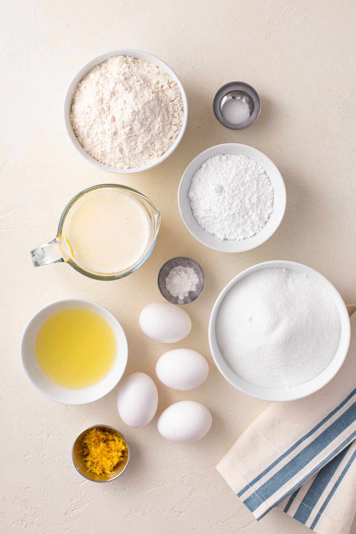 Ingredients for easy lemon bars arranged on a countertop.