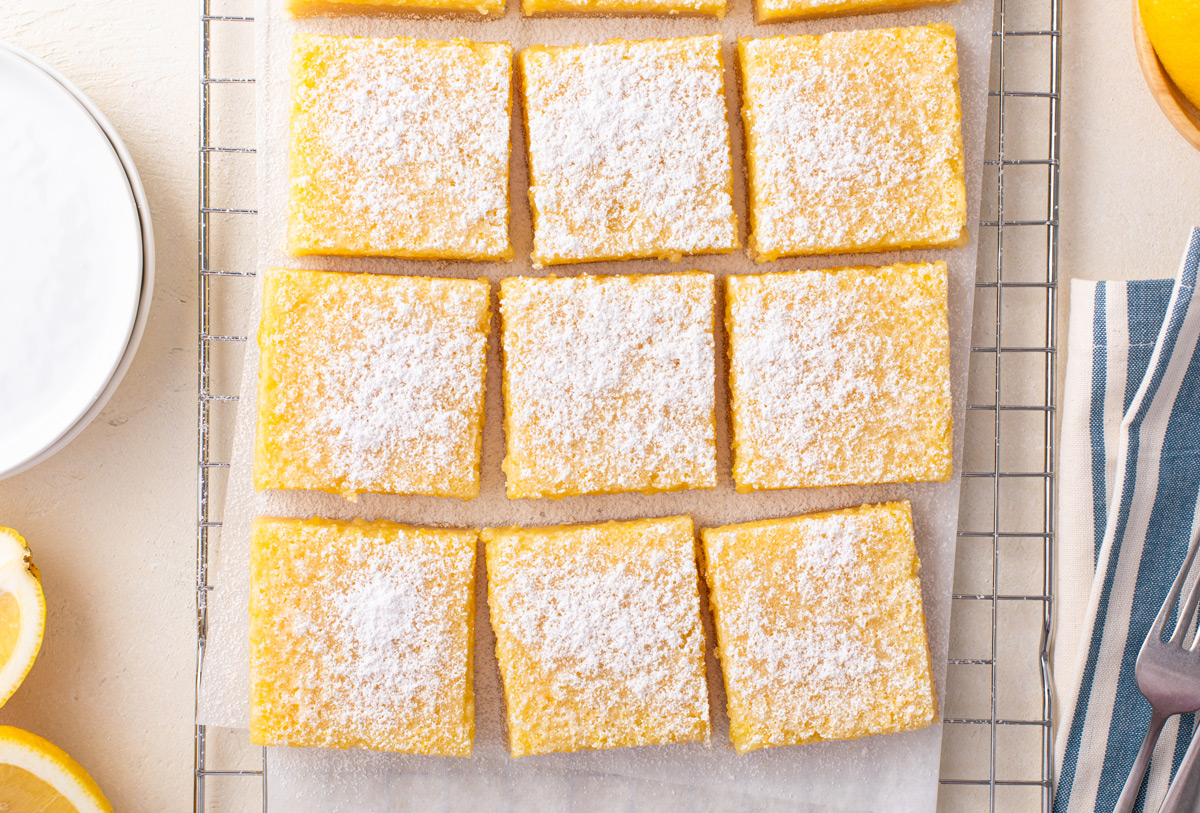 Overhead view of sliced lemon bars dusted with powdered sugar.