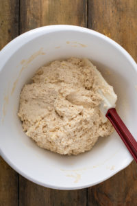 Angel biscuit dough stirred together in a mixing bowl.