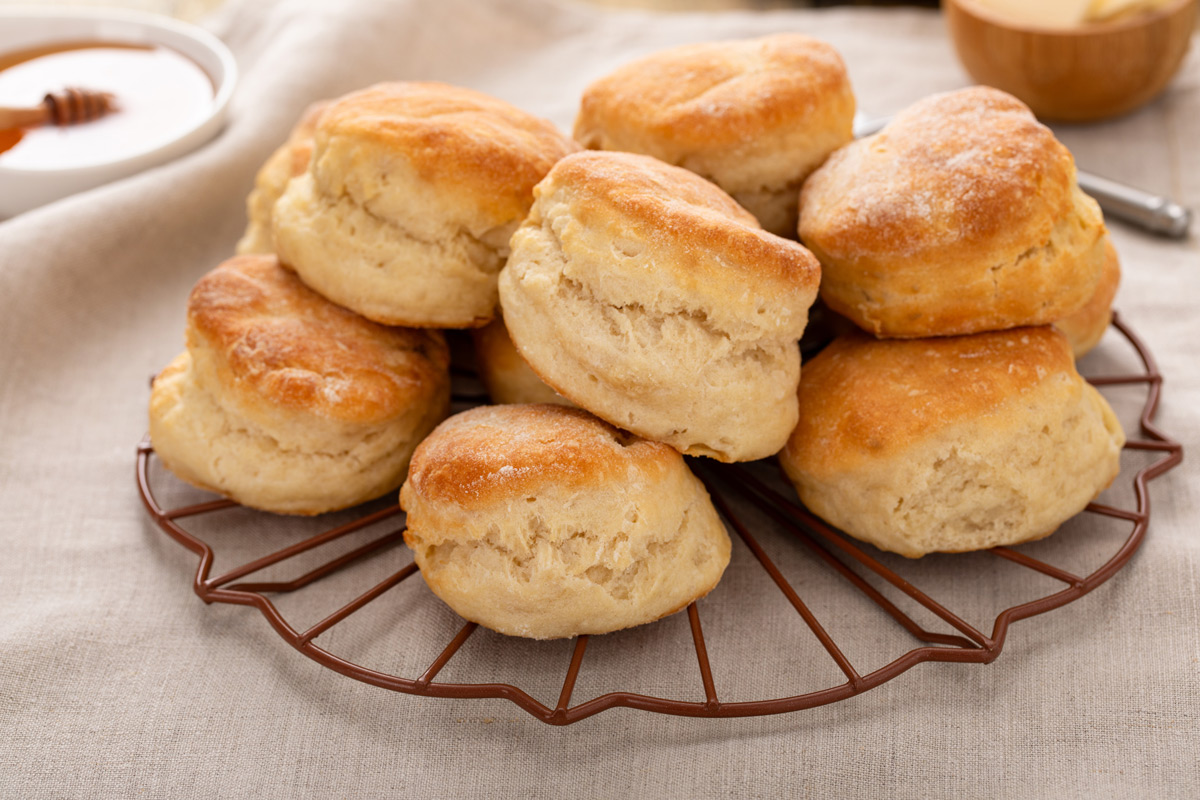 A batch of angel biscuits arranged on a decorative wire rack.