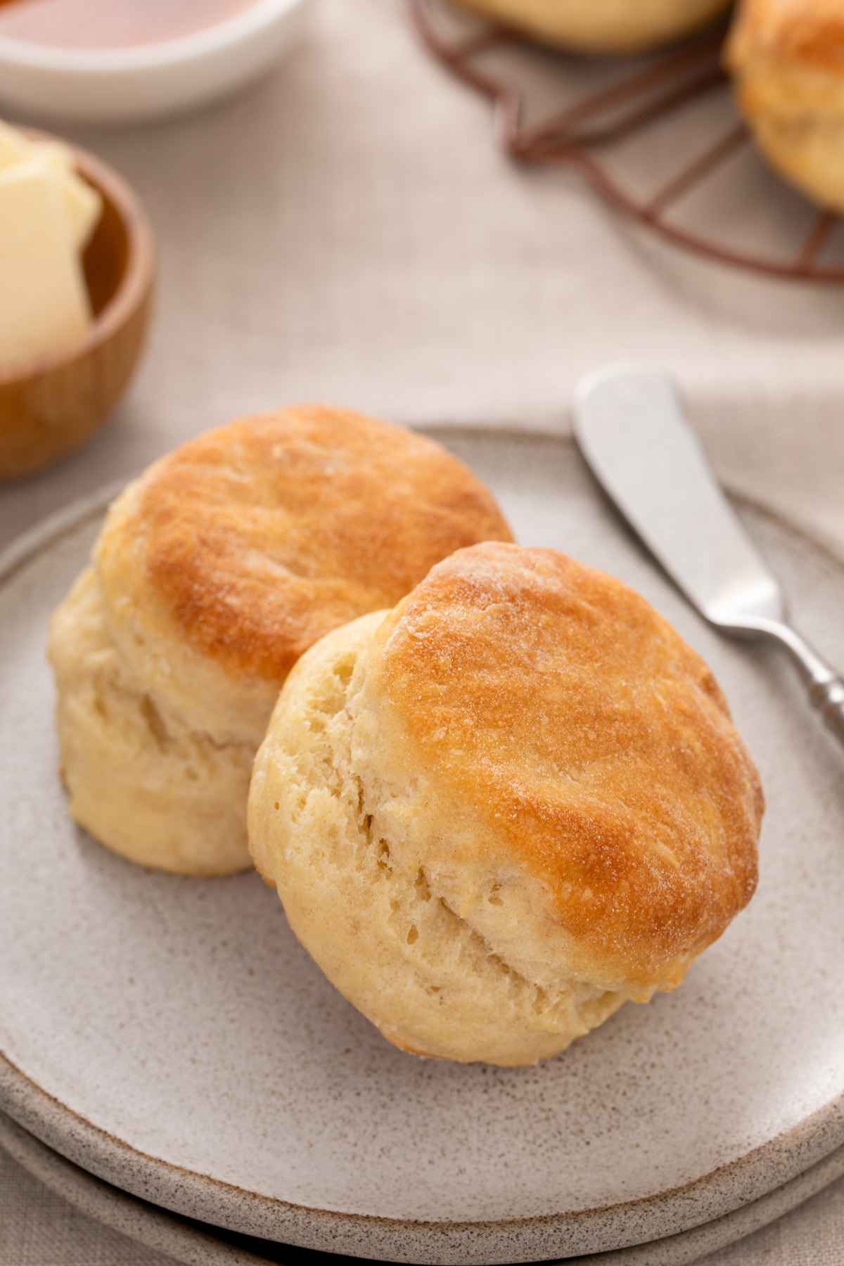 Two angel biscuits arranged on a plate.